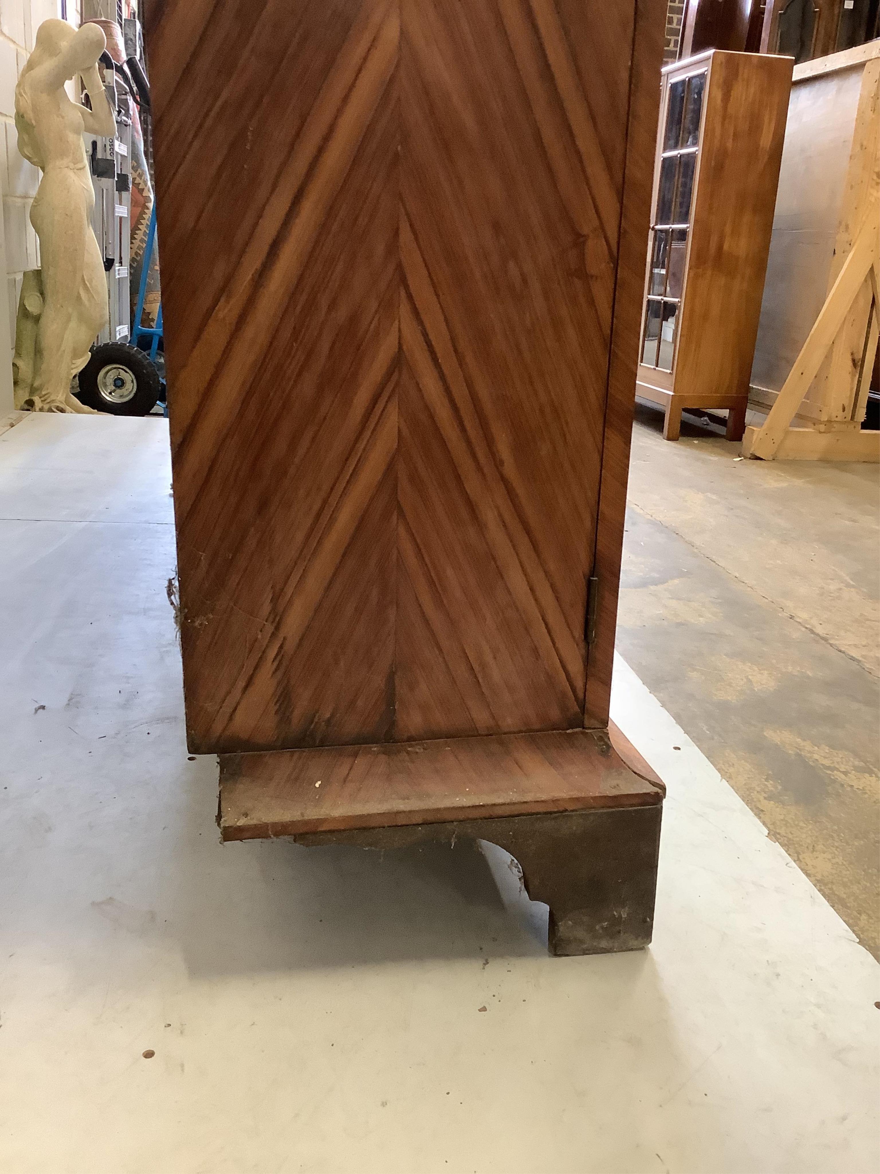 A large 19th century glazed kingwood bookcase, fitted four hinged doors and three adjustable shelves, width 190cm, depth 36cm, height 145cm. Condition - poor